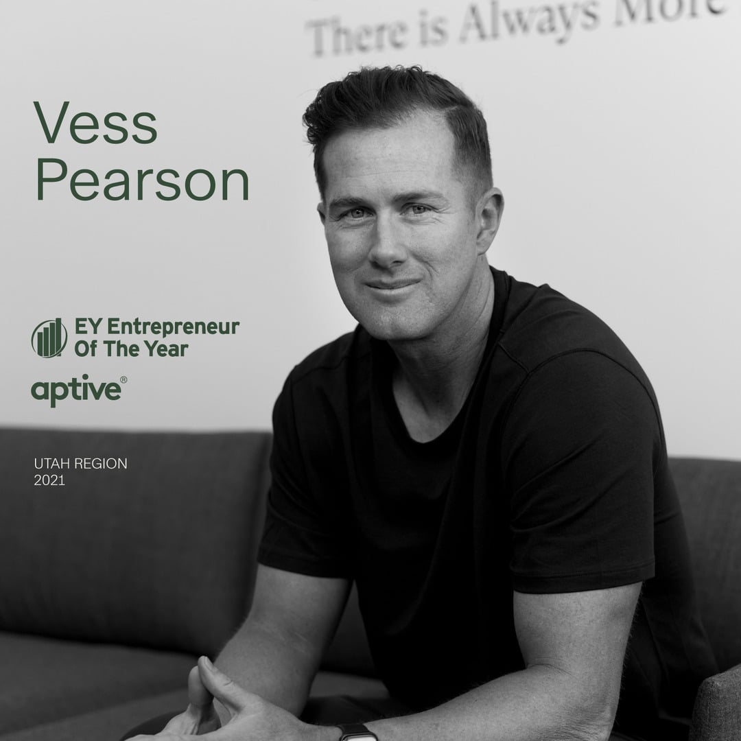 Vess Pearson, CEO of Aptive, sitting and smiling, with text "Vess Pearson EY Entrepreneur Of The Year Aptive Utah Region 2021."